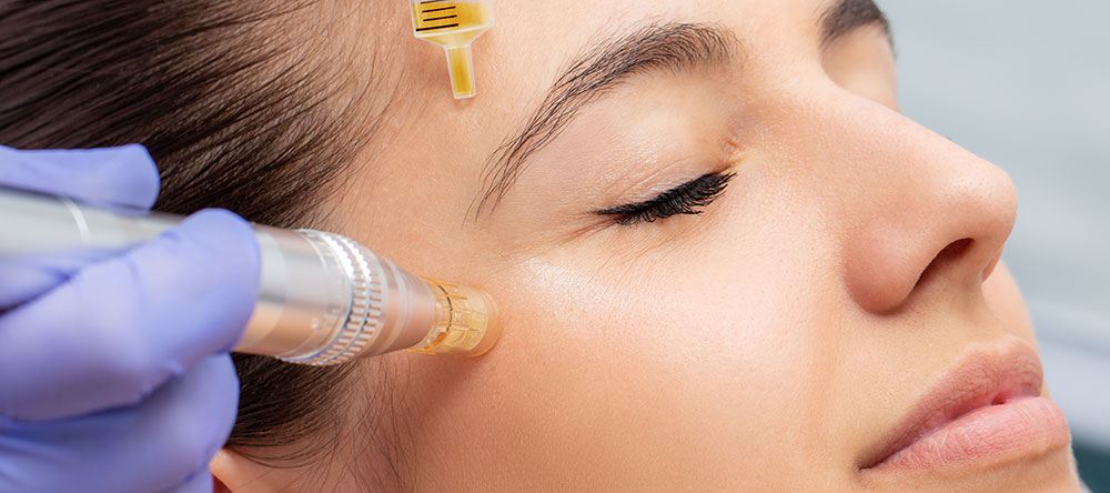 A woman receiving a cosmetic treatment with a syringe, likely botox or filler, at a clinic.