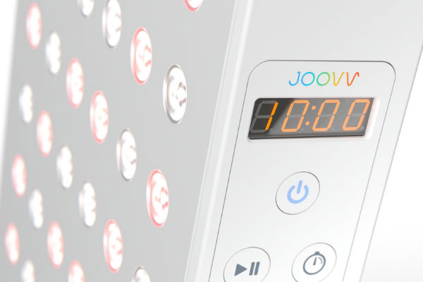 The image shows a digital timer with a red start button and a green stop button, set against a white background.