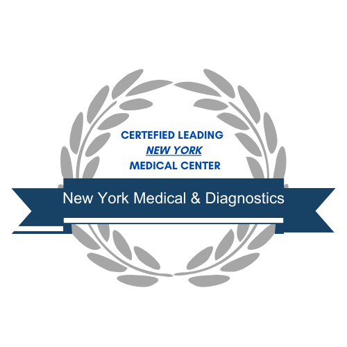 The image features a circular emblem with laurel leaves and a ribbon at the bottom, containing text that reads  New York Medical   Diagnostics.  The background of the emblem is blue, and it appears to be a logo or emblem for a medical facility.